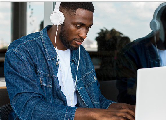 Student learning online with headphones